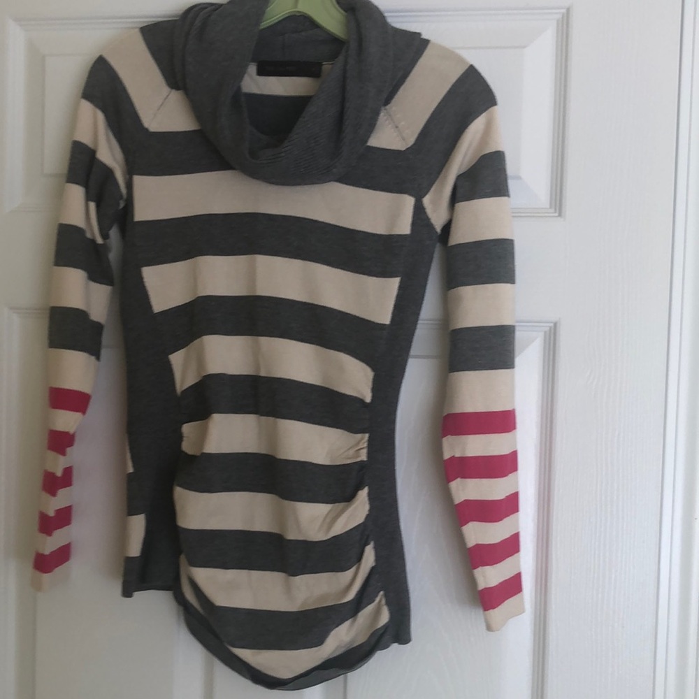 The limited sweater size small. Grey,  creme and hot pink stripes, rushed sides.